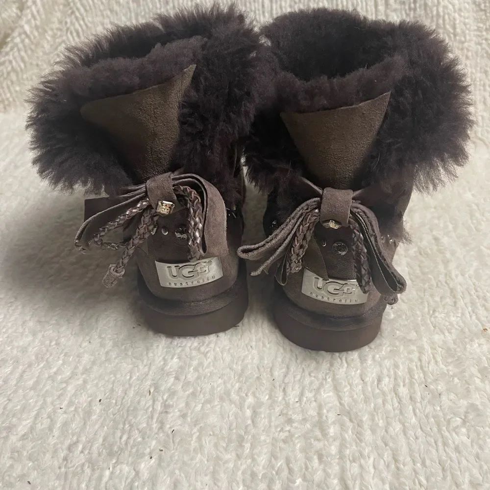 UGG Chocolate Shearling Boots with crystal and studs and bow accents SZ7